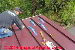 Eric Galow, Galow Homes, Poughkeepsie NY, prepping the roof surface for snow guard installation (C) Daniiel Friedman Eric Galow