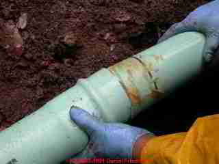 Photograph of making connections on plastic sewer line piping