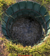 Backup at septic tank riser lid? Possible field failure ? (C) InspectApedia.com C&EC