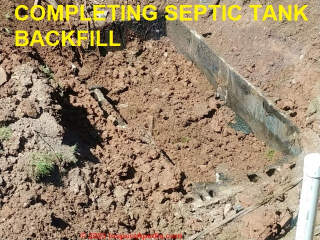 Completing backfill of abandoned septic tank - must be filled completely with solid compacted fill for safety (C) InspectApedia.com A Church