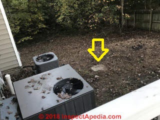 Concrete cover probably marks septic tank location (C) InspectApedia.com Jenna