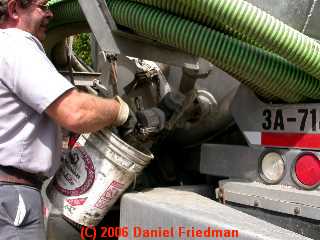 PHOTO of opening the septic pumper truck tank valve cover. 