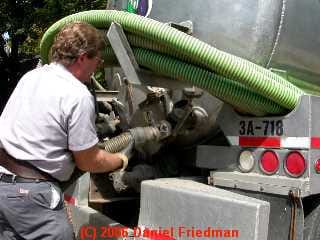 PHOTO of connecting the septic pumper truck vacuum line.