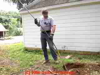 PHOTO of the septic tank muck raking tool used to break up scum
and sludge layers during pumping.