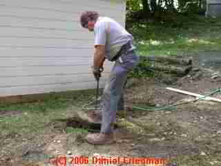 PHOTO of the septic tank cleanout cover being replaced.