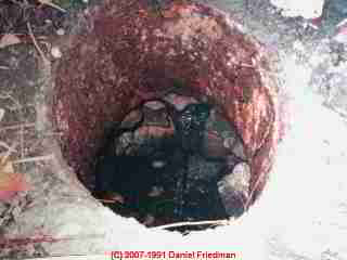 Collapsing home  made septic tank with steel components © D Friedman at InspectApedia.com 