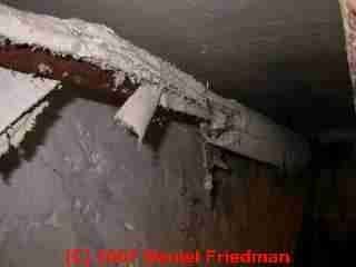 Asbestos pipe insulation in poor condition (C) Daniel Friedman