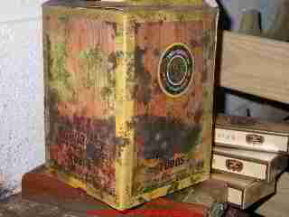 Photograph of thick green mold on a box and other items