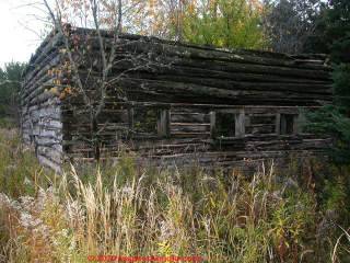 Antique log walls still standing, twisted wood (C) InspectApedia.com Church