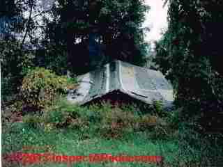 Collapsed low slope roof © Daniel Friedman at InspectApedia.com