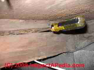 Solid wood beam with significant crack split or checknig (C) Daniel Friedman