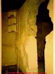 Photograph of - cracked  masonry block foundation wall, probably from earth pressur at original construction - notice the wavy mortar. Drop a plumb line to measure total inwards bulging of this block foundation wall.