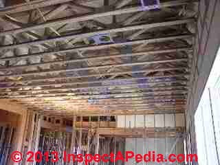Ceiling trusses in a modern home (C) InspectApedia.com JWS