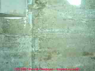 Photograph of cold pour joints and horizontal cracks in a poured concrete foundation wall