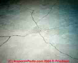 Photograph of a cracked concrete slab from frost heave damage