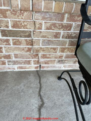 Foundation & brick veneer wall significant cracks, damage, movement (C) InspectApedia.com Jen