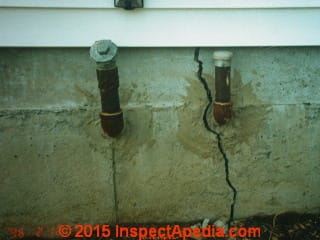 Poured CONCRETE foundation with settlement cracks due to blasting © Daniel Friedman at InspectApedia.com