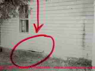 Photograph of a leaning foundation wall © Daniel Friedman at InspectApedia.com