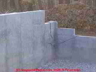 Photograph of a cracked poured concrete wall, probably settlement and/or bad mix - repair needed