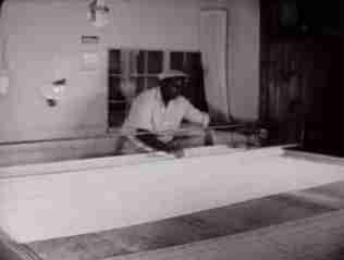 Black worker, bamboo blind Co., Leavittown PA 1954 (C) D Friedman