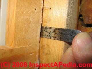 Measuring a leak point in a log wall at a window jamb