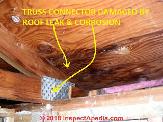 Truss connector plate damaged by roof leak and corrosion (C) Daniel Friedman at InspectApedia.com