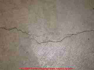 Photograph of a classic shrinkage crack in poured concrete.