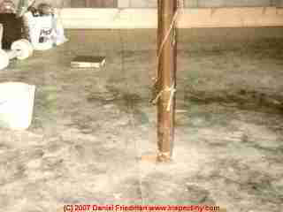 Photograph of a basement floor slab crack