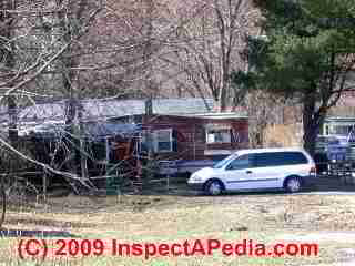 Mobile home with bad roof (C) Daniel Friedman