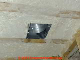 Bath exhaust fan in insulated ceiling after foam insulation installation (C) Daniel Friedman