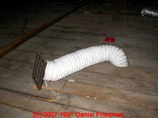 Bathroom exhaust vent improperly spilling into attic area (C) Daniel Friedman at InspectApedia.com