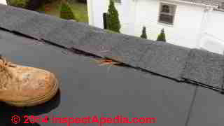 Hot roof design leaks at ridge vent (C) InspectApedia TG