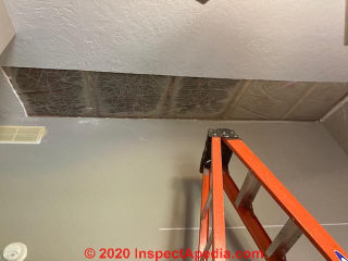 Moldy insulation due to inadequately-vented roof (C) InspectApedia.com DanK