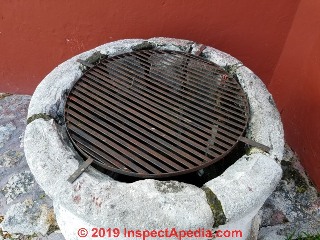 Safety screen over the top of a dug well in Campeche Mexico (C) Daniel Friedman at InspectApedia.com