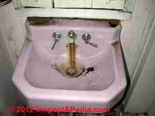 Iron stains on bathroom sink (C) D Friedman