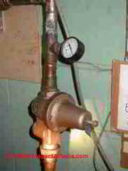 Water pressure gauge mounted at a water pressure regulator - municipal supply (C) Daniel Friedman