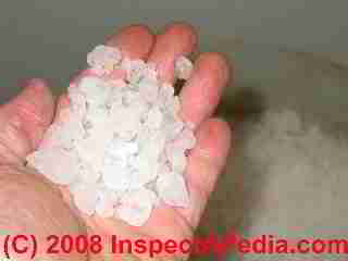 Closeup photo of water softener salt in the hand