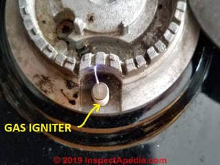 Gas igniter in operation on a Bosch gas cooktop (C) Daniel Friedman at InspectApedia.com