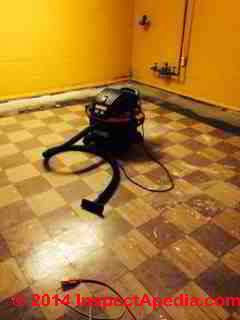Asphalt asbestos flooring during home renovation (C) InspectApedia