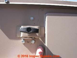 Latching thumbscrew on a commercial rooftop air handler compartment cover (C) Daniel Friedman