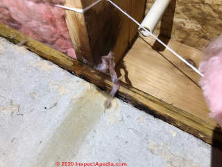 A/C Condensate improperly disposed in building wall cavity (C) InspectApedia.com Natale