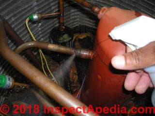 Refrigerant leak at A/C compressor/condenser unit (C) InspectApedia.com F.G.
