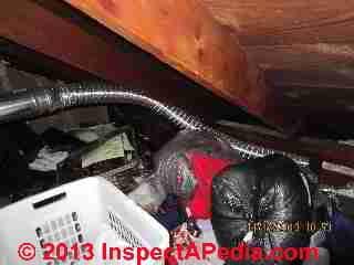 Unsafe gas appliance vent and chimney installation(C) InspectAPedia David Grudzinski