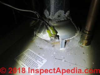 Water heater shares flue with a gas fired steam boiler - unsafe connection, blow-back at water heater draft hood (C) Daniel Friedman at InspectApedia.com