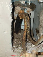 short in 1940s electrical wiring at receptacle (C) InspectApedia.com Stephanie