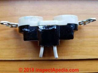 Backwire-only receptacle from 1962 or 1963 has no screw terminals (C) Daniel Friedman at InspectApedia.com
