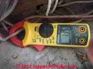 A W Sperry Instruments Digisnap DSA-500 digital multimeter with snap around ammeter in use at the electric meter (C) Daniel Friedman