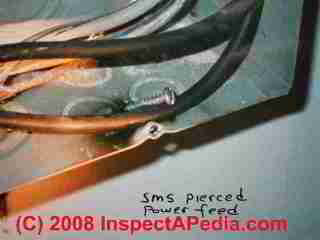 Sheet  metal screw shorts wire in electric panel (C) Daniel Friedman