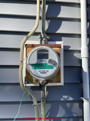Wires run outside of home by electric meter: what are they (C) InspectApedia.com Don