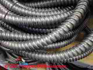 Flexible electrical conduit in an allowed outdoor use © D Friedman at InspectApedia.com 